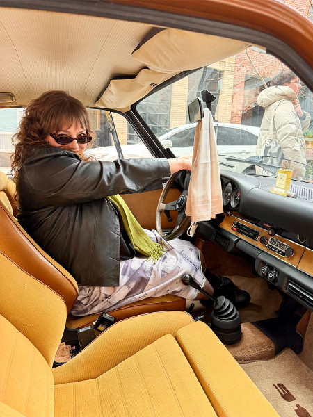 Image may contain Adult Person Transportation Vehicle and Car